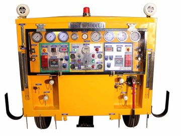 Yellow industrial control panel with gauges and switches labeled HST-300(U).