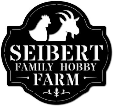 Black and white farm sign with chicken and goat silhouettes.
