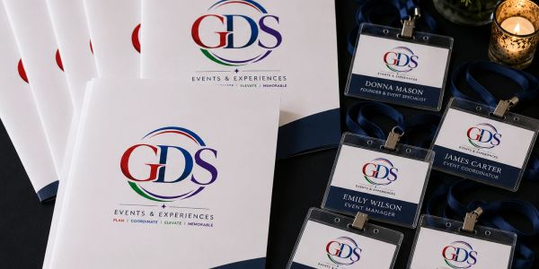 Event brochures and name badges for GDS Events &amp; Experiences.