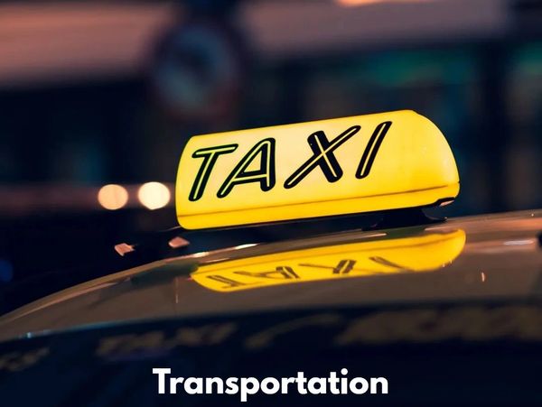 Top view of a taxi with taxi sign in yellow color and a quote written on it