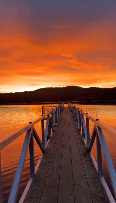 King Tide boats offering Sooke fishing charters tied at the private dock at sunrise