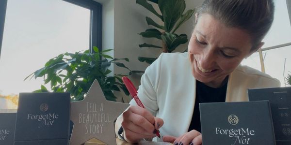 A woman sharing a beautiful story on Forget me not cards