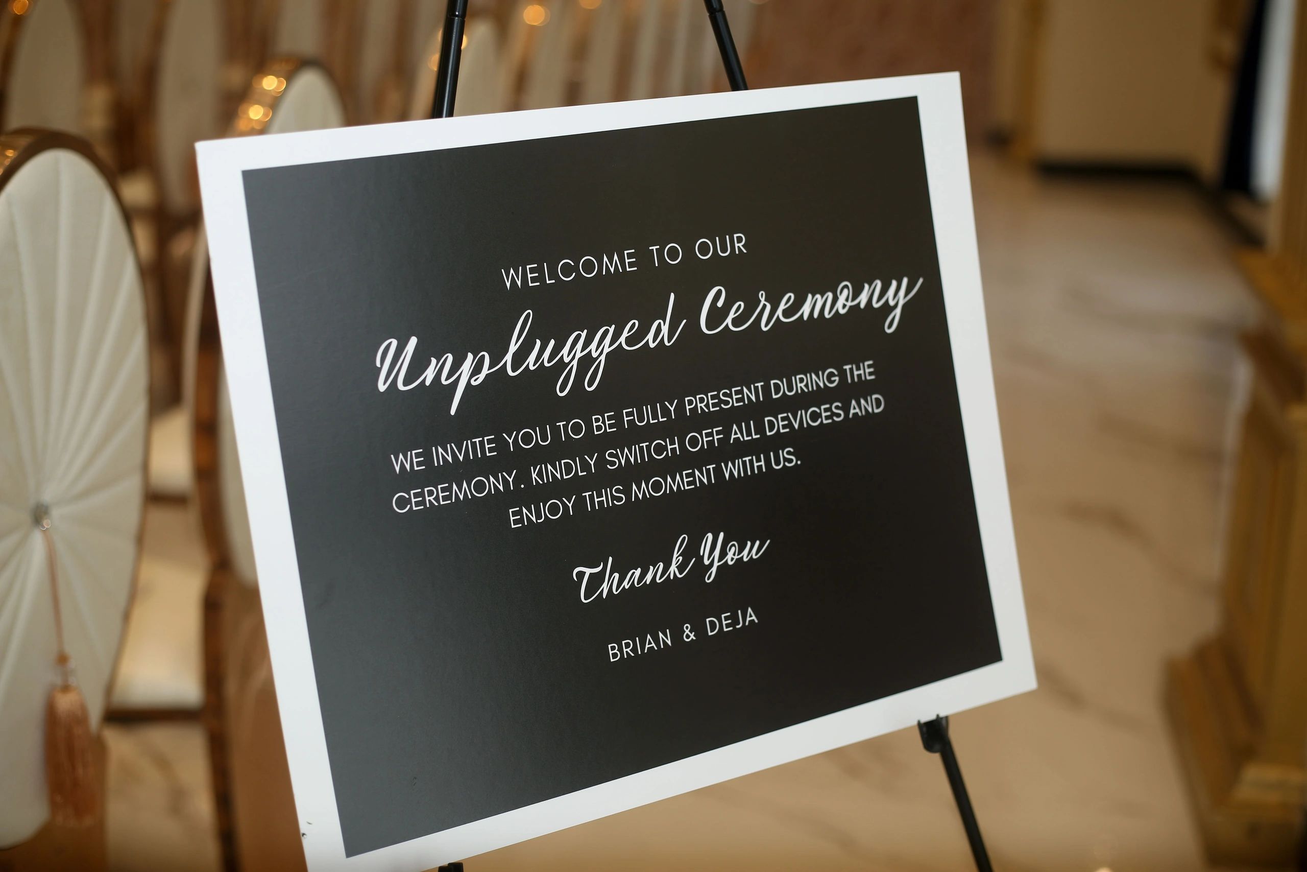 A sign inviting guests to an unplugged ceremony, requesting no device use.