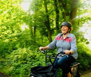 lady laughing on an e-bike