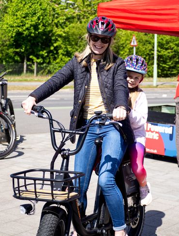 mother and daughter on one e-bike