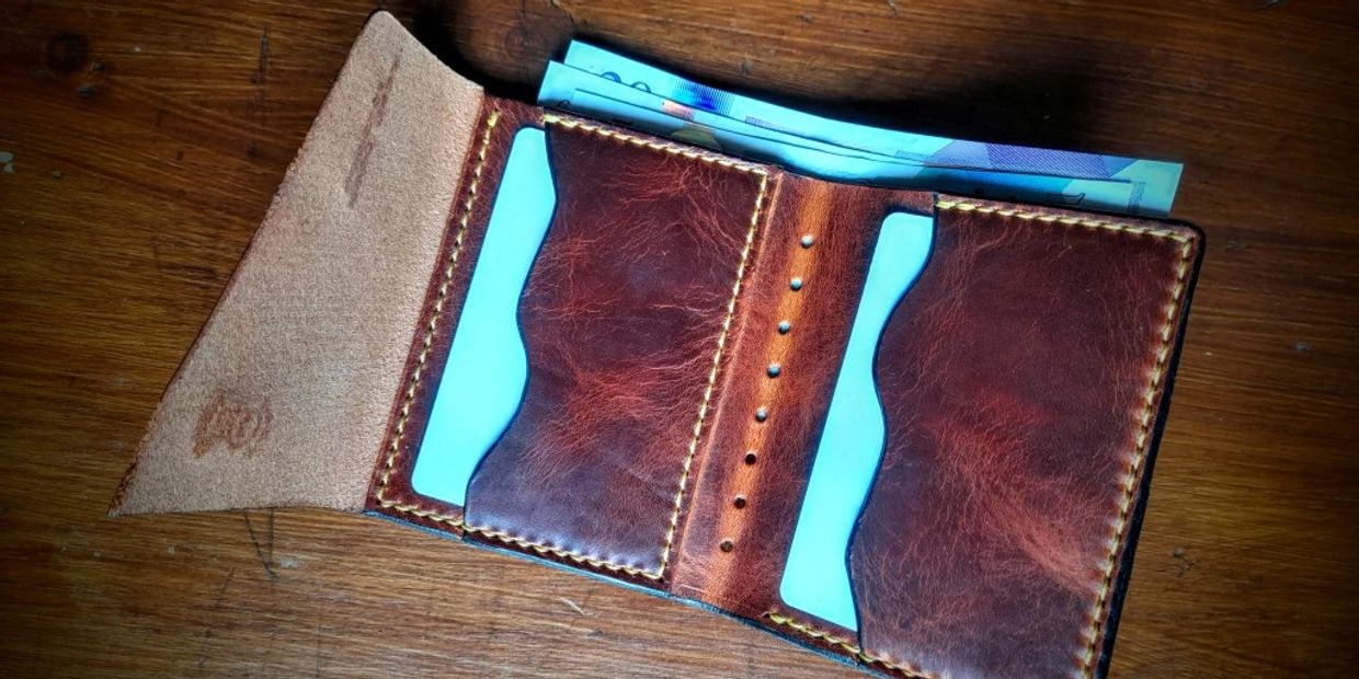 open leather wallet with credit cards and cash