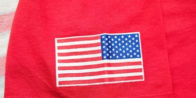 Arm of the Men's and Woman's RED T-shirt