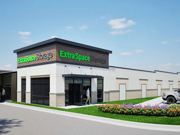 Exterior view of ExtraSpace Storage facility with multiple storage units and landscaping.