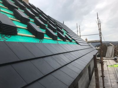 A new roof nearing completion in Belfast, by Apex Roofing Solutions