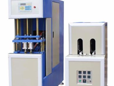 Two-piece industrial machine with control panels.