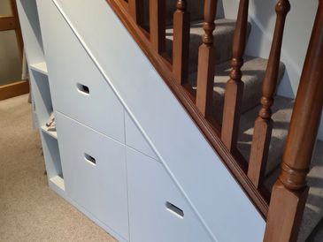 Bespoke under-stairs pull-out drawers installed by MJD Joinery, Isle of Man