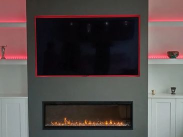 Modern home cinema joinery with a recessed TV, handcrafted by MJD Joinery IOM. Joiner Carpenter 