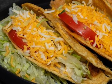 Filled with lettuce, tomato, and cheese.