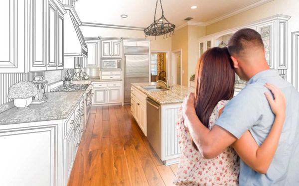Couple envisioning their future kitchen renovation with a blend of design and reality.
