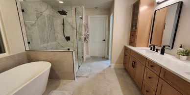 master bathroom with tub and shower