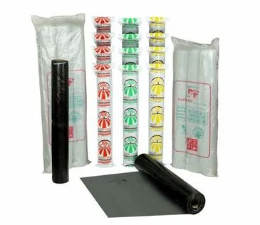 Rolls of black and colored plastic bags with packaging.