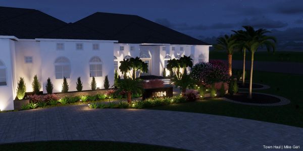 Night view of a luxurious house with outdoor lighting.
