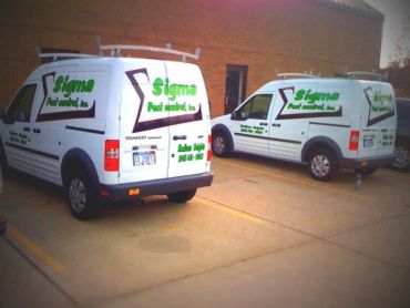 Two Sigma Pest Control service vans parked outside.