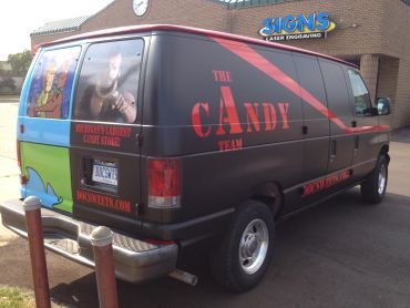 Van with The Candy Team logo and website.