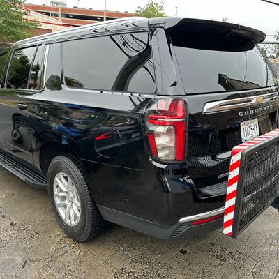 Rear view of a black SUV parked.