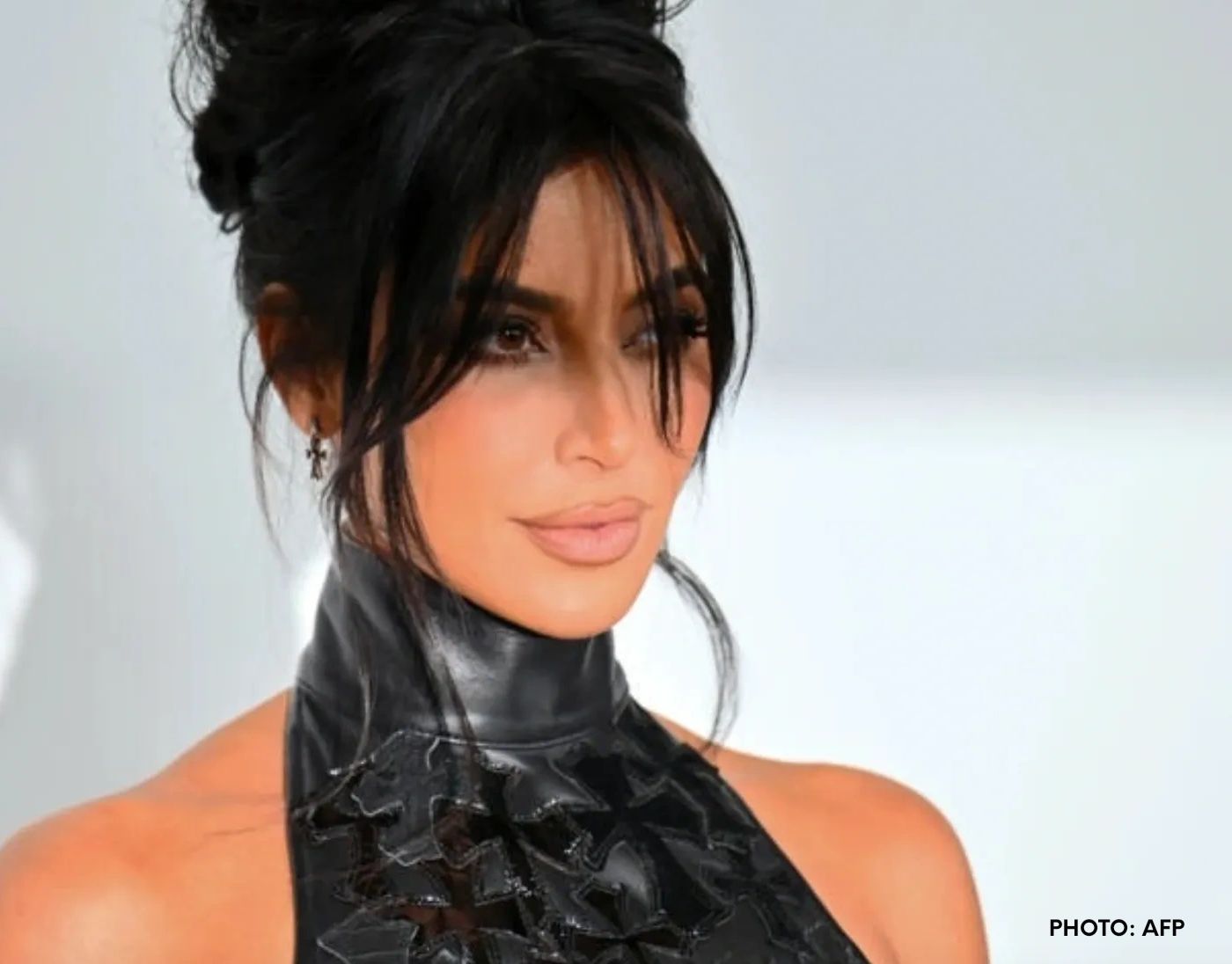 Kim Kardashian rocks a classic mob wife hairstyle to an event in LA. 