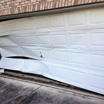 I wouldn't suggest driving into the door but we can replace all the garage door panels to save costs