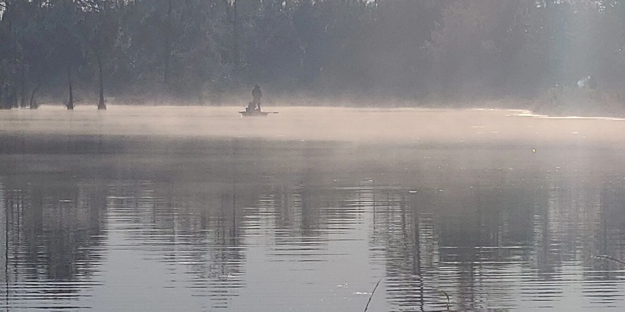 Man fishing on a kayak. 