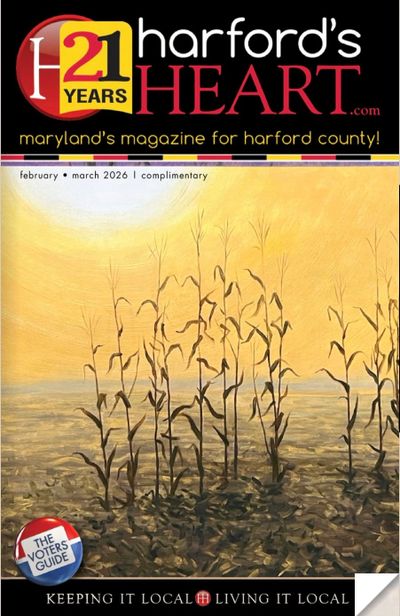 Cover of Harford's Heart magazine featuring a serene cornfield under a warm sun.