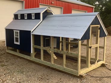 This coop features an optional automatic door inside the run area.