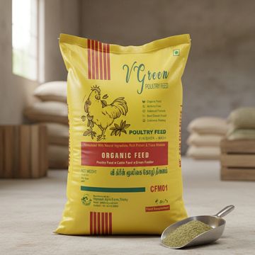Yellow bag of VGreen poultry feed with a scoop of greenish feed powder.