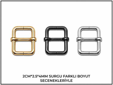 Farklı renklerde üç metal tokalar, altın, siyah ve gümüş.