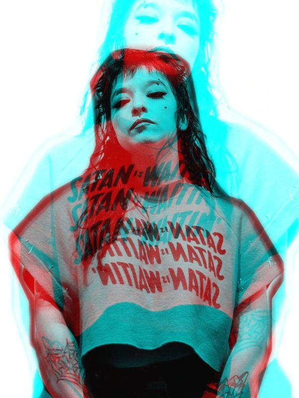 Double exposure of a woman wearing a graphic shirt.