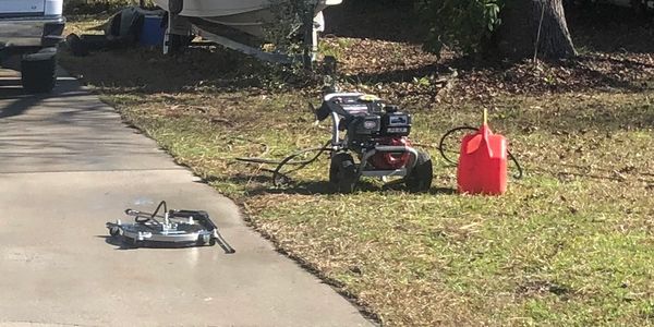 Pressure washer used for driveway cleaning