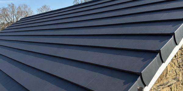 Modern black metal roofing on a house.