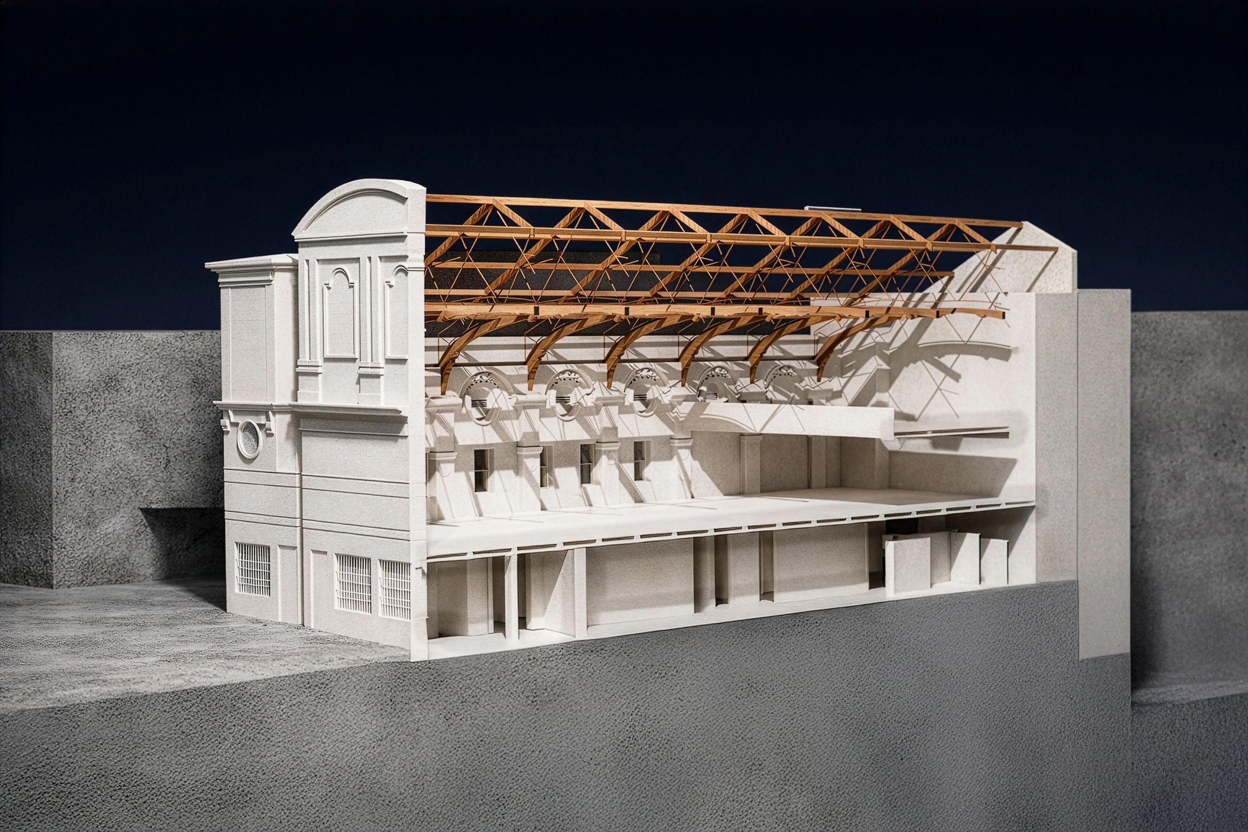 Architectural model displaying a detailed cross-section of a classical building with wooden roof trusses.