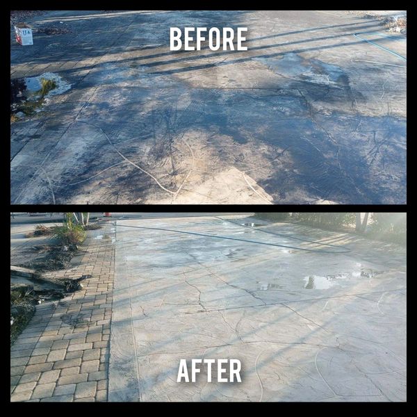 Driveway,lot with oil and ash clean up from burnt down RV