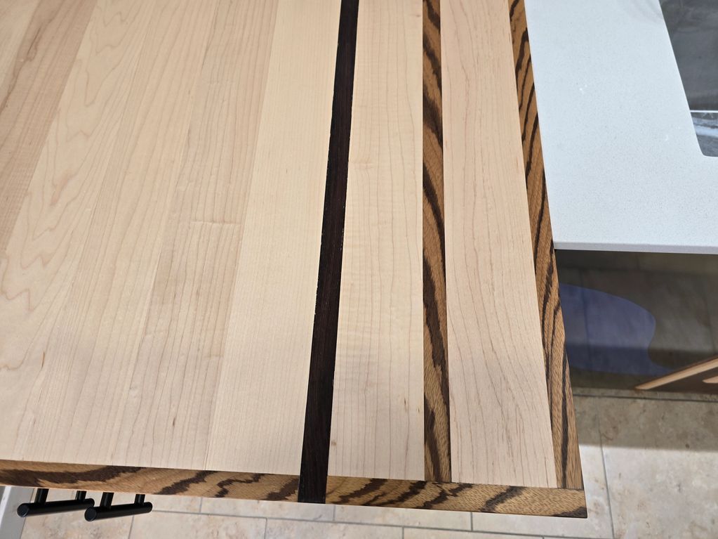 Close Up of our Custom designed counter top.  Exotic woods and Maple mix.
