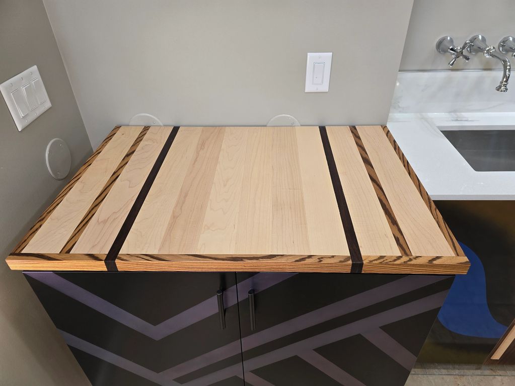 Solid Wood/ Exotic Woods, with a mix of Zebra Wood, Wenge and Maple.  Custom handcrafted.