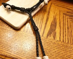 Braided leather curb strap rawhide buttons