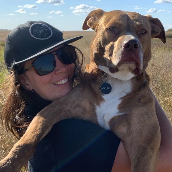 Ashley veterinary receptionist with a dog