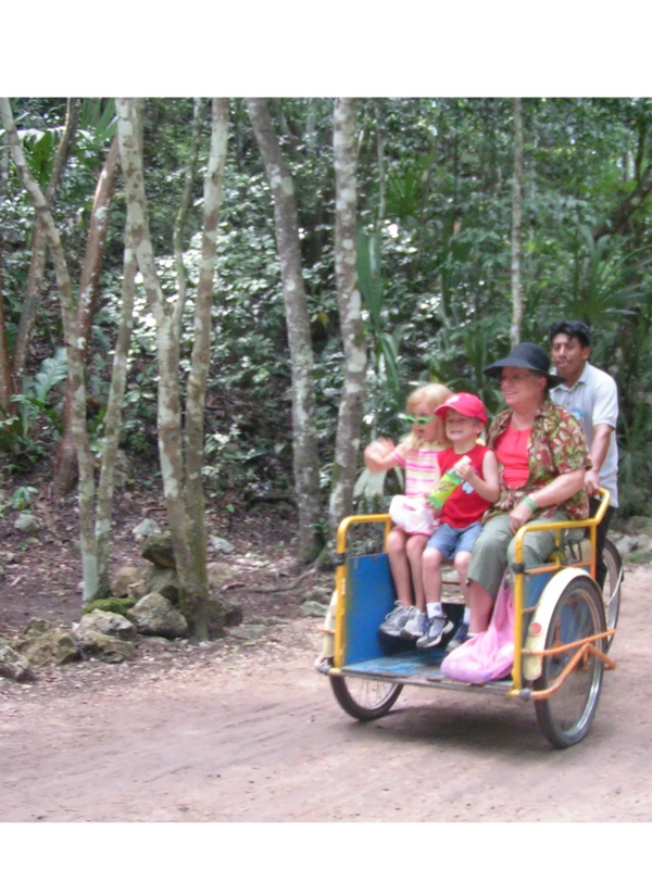 Large tricycles are one means of transport on jungle trails.