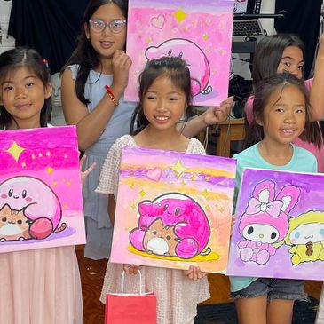 Children proudly holding colorful cartoon art paintings.
