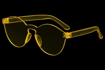Transparent yellow-rimmed sunglasses on black background.
