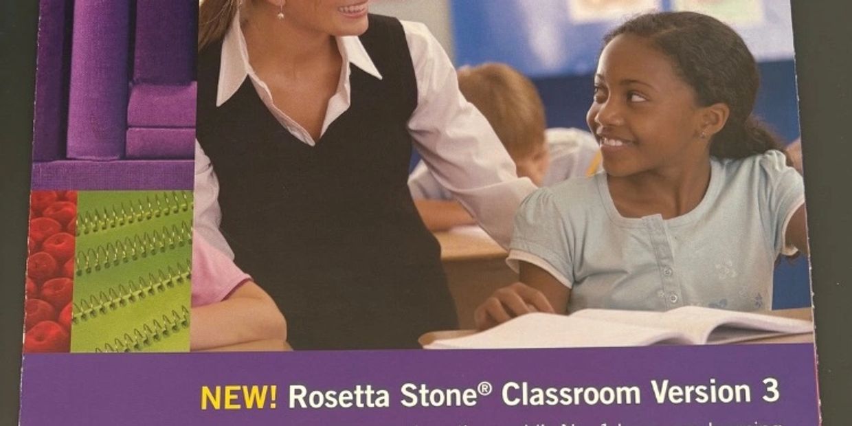 Rosetta Stone Classroom Version 3 brochure cover showing a teacher smiling with a student at her des