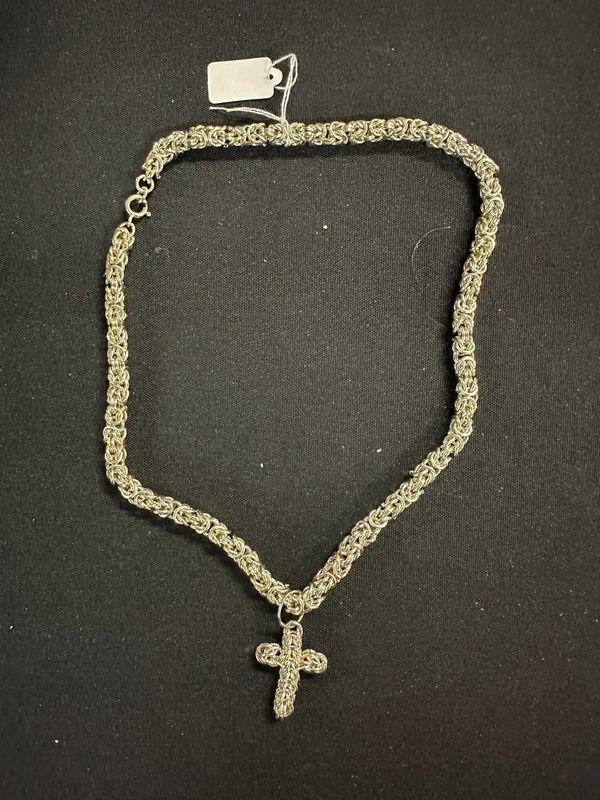 Sterling Silver Cross Necklace on black background