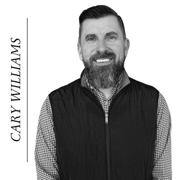 Portrait of a smiling man with a beard.