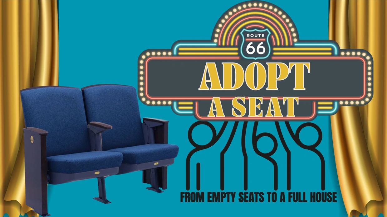 Blue theater seats with a Route 66 'Adopt a Seat' sign and curtains.