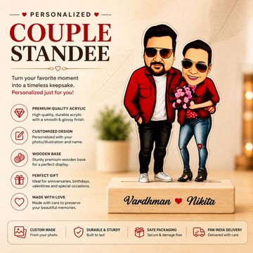 Personalized couple standee with caricature and names on wooden base.