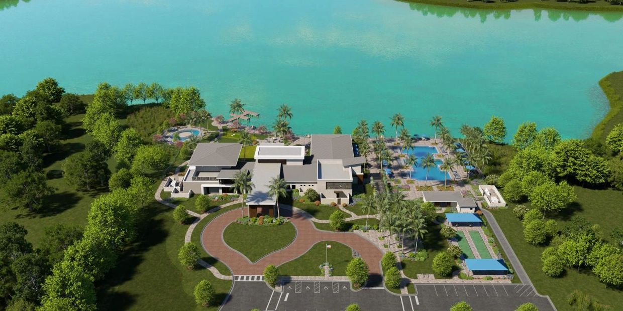 Aerial view of the Vivid Shores amenity campus and lakefront clubhouse in Bonita Springs, FL