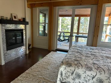 Marcy bedroom on main floor with  gas fireplace and bathroom